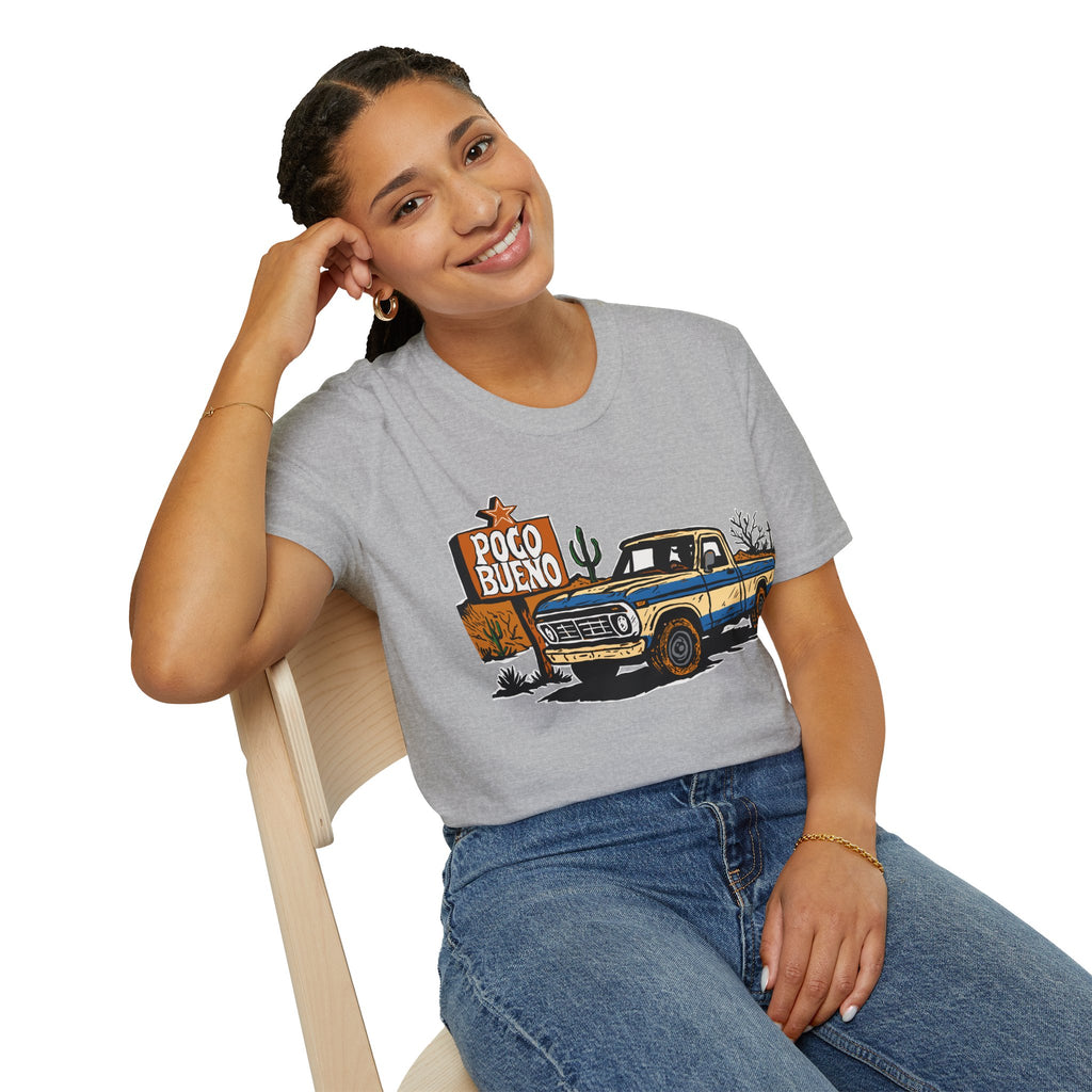 Woman wearing a gray t-shirt with a graphic design of a truck and 'Poco Bueno' sign.