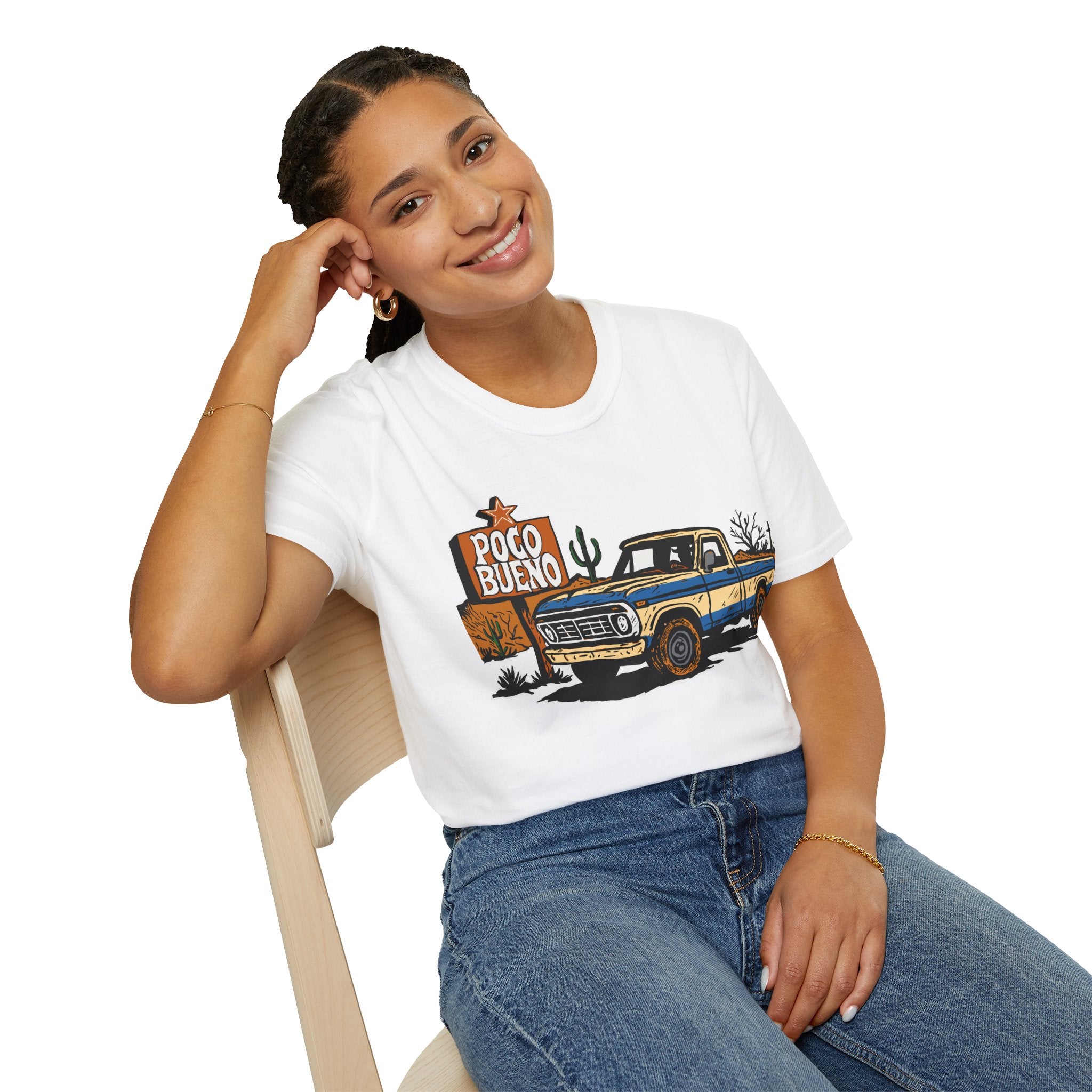 Person wearing a white t-shirt with a graphic design of a truck and 'Poco Bueno' sign.